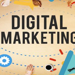 3 Key Steps To Starting A Digital Marketing Strategy 31 A group of people gathered around a table, working on digital devices and collaborating on a project. The word "DIGITAL MARKETING" is prominently displayed in the center.